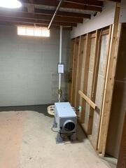 The flooring is restored and Aprilaire is installed