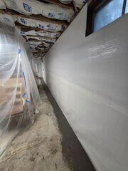 WaterGuard® - An interior perimeter drainage system installed on top of the foundation footing and beneath the edge of the basement floor. WaterGuard collects incoming groundwater and wall water and directs it toward the sump pump system.
CleanSpace® Wall System - A durable wall system that intercepts water entering through foundation walls and directs it downward into WaterGuard while providing a clean, bright appearance.