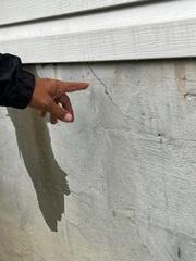 Exterior wall cracks due to a shifting foundation.