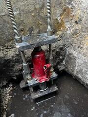 Push Pier that is used to lift and stabilize a  home's foundation.