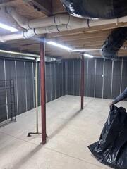 Basement-to-Beautiful® Wall System - A basement wall pre-finishing system combining continuous R-13 SilverGlo graphite-infused rigid foam insulation with integrated steel framing. The 2½-inch panels include built-in wiring channels and provide attachment points for future wall finishes, eliminating the need for conventional wood framing and fiberglass insulation.