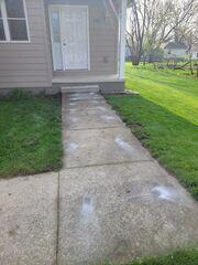 During: The crew succesfully lifted the damaged and sinking sidewalk back to its original level.