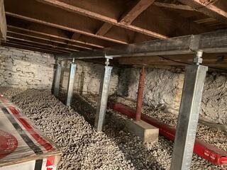 Once the concrete cures, the crew installs the SmartJacks and supplemental beam.