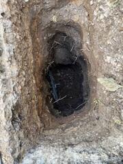 The crew placed the earth anchor and connected it to the interior wall using a small steel pole that runs through the ground