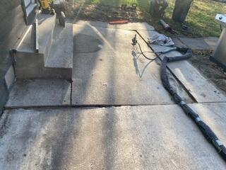 Our crew in the process of lifting one of the slabs along the back entrance