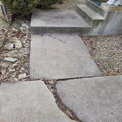 A close up of the slab connecting to the step where cracks have formed due to settlement