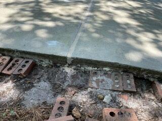 We replaced the wood with backer rod covered the rod with NexusPro Crack Repair and smoothed over the surface.
