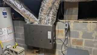 ERV unit mounted inside crawlspace