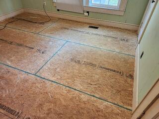 The floor has been removed and replaced, restoring a stable, level floor that the customer can lay new flooring over.