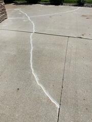 During: Our Foreman, Charlie, and his crew worked hard to lift and level the damaged slabs.