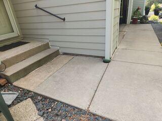 Before: Our Design Specialist, Dave, recommended securing PolyLevel below the sinking concrete slabs.