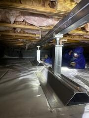 SmartJacks are adjustable steel columns that lift and stabilize sagging floors.