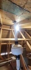 A properly sized radon fan in the attic vents the gas above the roofline.