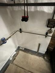 During: Our Foreman, Aaron, and his crew worked hard to secure all the waterproofing products throughout the basement.