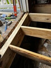 We removed the old rotten sister joists and replaced them with new wood.