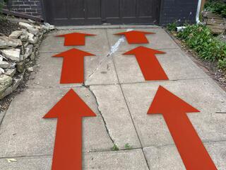 This graphic, (captured from a different job site) shows the directional force a nearby street can cause on a driveway when the street swells up in the summer. As you can see, most of the time street creep results in damage to a backside wall opposite of the garage door opening.
