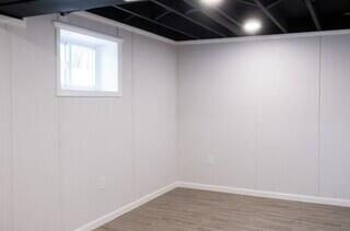 EverLast wall panels were installed throughout the basement to create clean, finished walls with materials designed to handle basement conditions.
