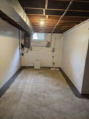 The team installed WaterGuard around the full perimeter of the basement to create a dedicated drainage path for water entering around the foundation. CleanSpace was then installed along the basement walls to help separate the interior space from moisture coming through the foundation walls. To replace the unreliable pumping setup with a more comprehensive solution, the team installed a TripleSafe sump pump system.