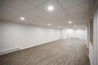 The EverLast Wall System was installed to transform the unfinished block foundation walls into clean, finished basement walls. Purpose-built finishing materials can be especially valuable in below-grade spaces where moisture and humidity need to be considered.