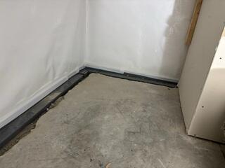 During: Our Foreman, Nanga, and his crew worked hard to secure all the waterproofing products throughout the basement.