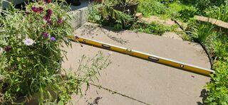 The walkway where it had sloped due to soil settlement