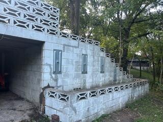 During: Our Foreman, Jose, and his crew worked hard to secure GeoLock Wall Anchors on the damaged foundation.