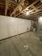 During: Our Foreman, Aaron, and his crew recommended securing several waterproofing products throughout the basement.