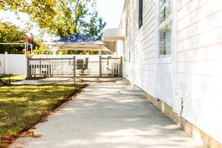 The completed Edison, NJ project features a completely new concrete walkway along with a newly installed SunHouse window well. The replacement addresses the severely settled walkway while giving the homeowner a fresh, finished surface around the side of the home.