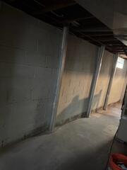 Our crew installed PowerBraces, securing them to the floor and floor joist.