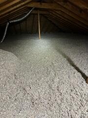 Blown-in cellulose insulation installed.