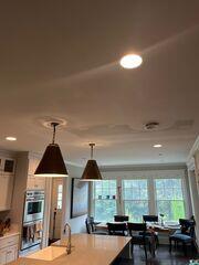 Repaired ceiling finished and painted, with the patched area blended into the surrounding ceiling.