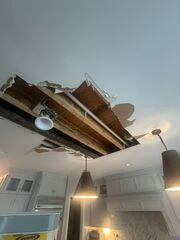 Alternate angle showing the extent of the ceiling opening across the kitchen.