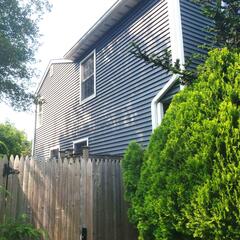 The second-floor room extends beyond the main exterior walls, creating a bump-out where cold outside air can seep through the floor joists, causing cold floors and drafts during the winter. In the summer, heat can enter through the same area, making the room uncomfortably hot.