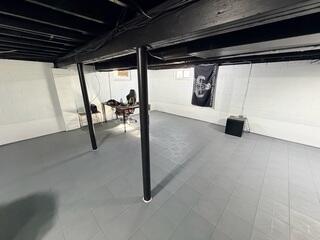 After completing the waterproofing work, our team at Quality 1st Basement Systems upgraded this basement with full-perimeter WaterGuard, a TripleSafe sump pump system, and new ThermalDry tile flooring. The combination helps manage groundwater while providing a moisture-resistant flooring option designed for basement environments.
