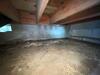 Inspecting a Damp and Dirty Crawl Space in Cobbs Creek, VA - Photo 2