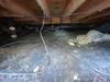 Inspecting a Damp and Dirty Crawl Space in Cobbs Creek, VA - Photo 1