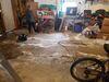 Settled Concrete Garage Floor Lifted and Stabilized with PolyLevel Foam in Abrams, WI - Photo 1