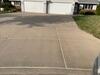 Concrete Driveway with Unlevel Slabs and Failing Expansion Joints Leveled and Protected in Combined Locks, WI - Photo 1