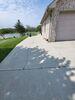 Cracked and Sunken Concrete Driveway Repaired With PolyLevel and NexusPro in Chilton, WI - Photo 1