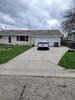 Concrete Driveway Repaired & Protected Using PolyLevel, NexusPro and Sealant Pro in Plymouth, WI - Photo 1