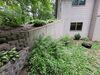 Leaning Retaining Wall Secured and Stabilized with GeoLock Installation in Amherst Junction, WI - Photo 3