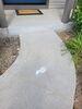 Uneven Concrete Driveway & Sidewalk Repaired with PolyLevel & Joint Sealant in Kiel, WI - Photo 1
