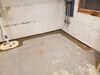 Corner Basement Workshop gets Waterproofing Installed in Shawano, WI - Photo 1