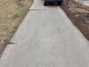 Concrete Driveway and Garage Floor Repaired and Lifted in Green Bay, WI - Photo 1