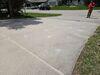 Uneven, Sunken Concrete Driveway Slabs Lifted & Sealed in Menasha, WI - Photo 1