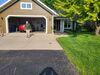 Sinking, Uneven Concrete Driveway Repaired & Sealed in Menasha, WI - Photo 4