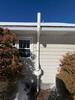 Exterior Radon Mitigation System Installed for Slab Home in Woodbury - Photo 1