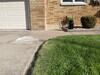 Concrete Repair & Leveling Helps Restore Cracked Driveway and Sidewalk in Oshkosh, WI - Photo 1