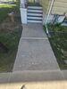 Cracked and Sunken Concrete Driveway Repaired in Oshkosh, WI - Photo 1