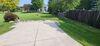 Concrete Parking area in Driveway Lifted and Repaired in Oshkosh, WI - Photo 1